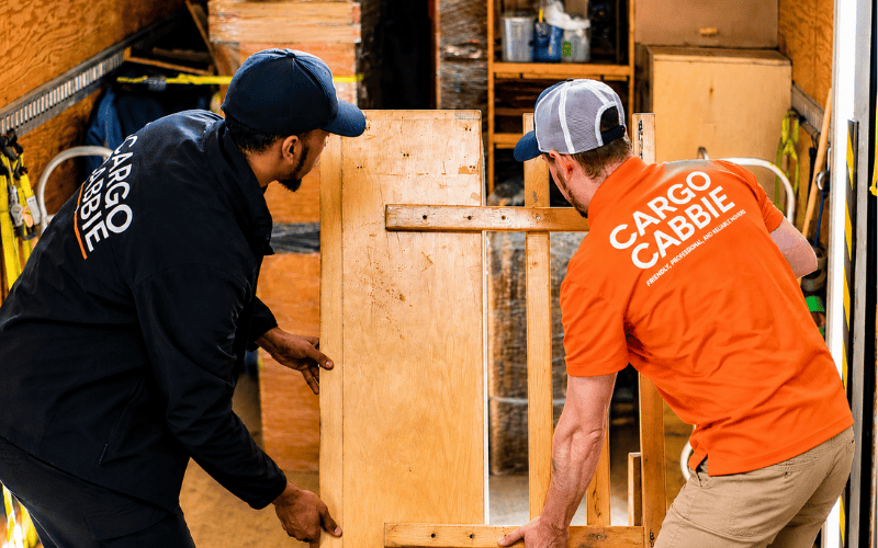 CARGO CABBIE crew loading furniture into the truck for removal and disposal in Toronto